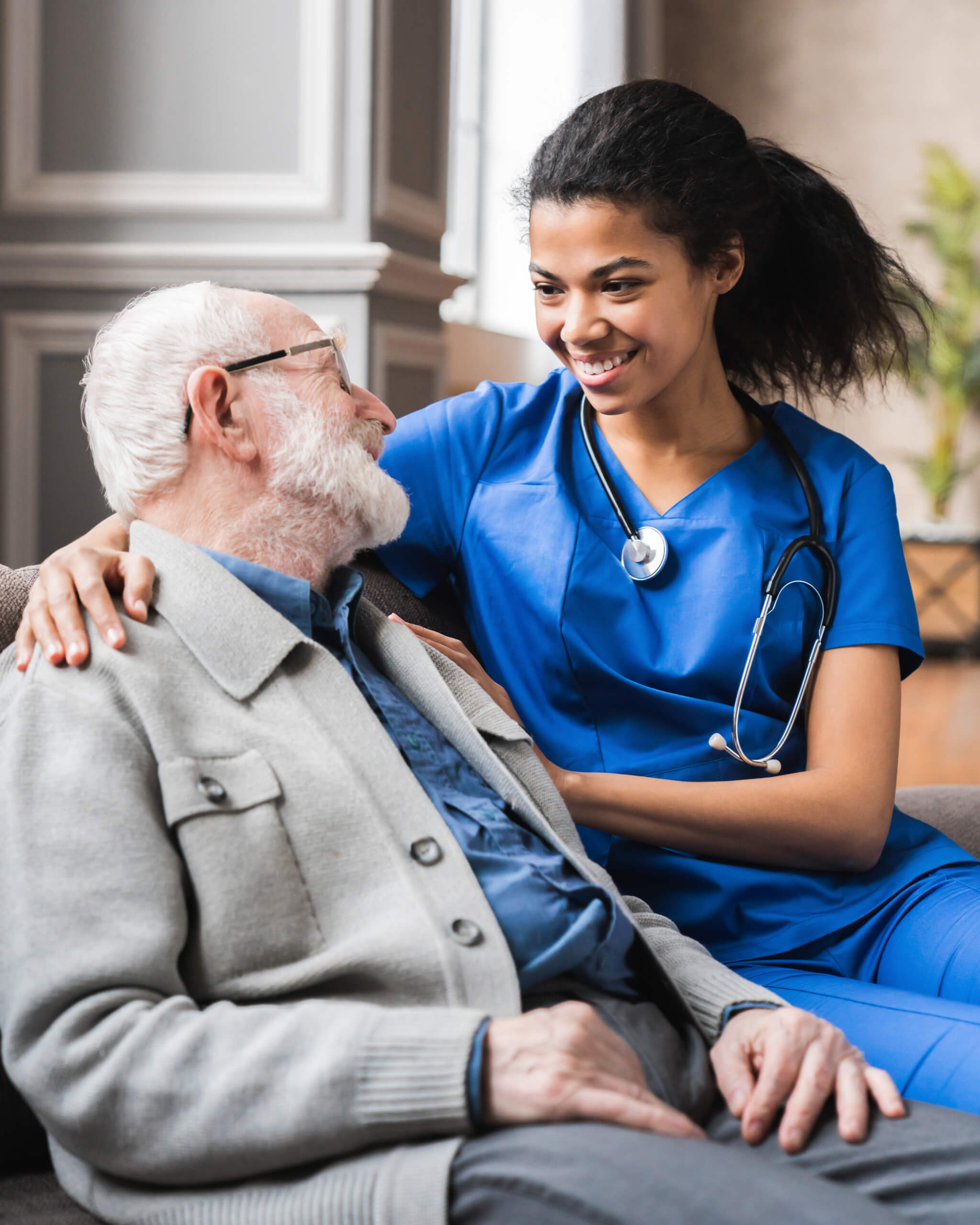 photo of helpful young female doctor nurse consulting old elderly man